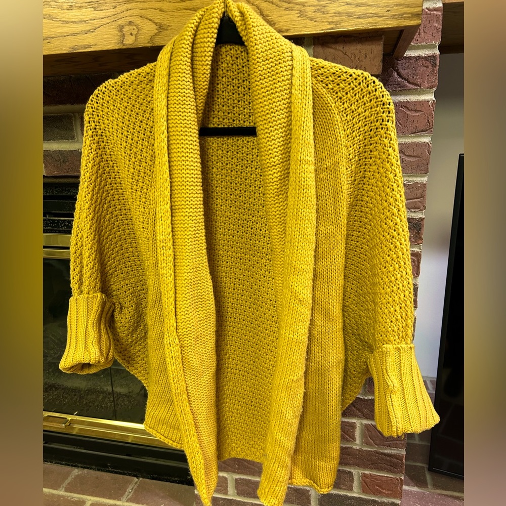 Mustard colored Cardi fits like a Large